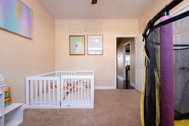 carpeted bedroom with a crib