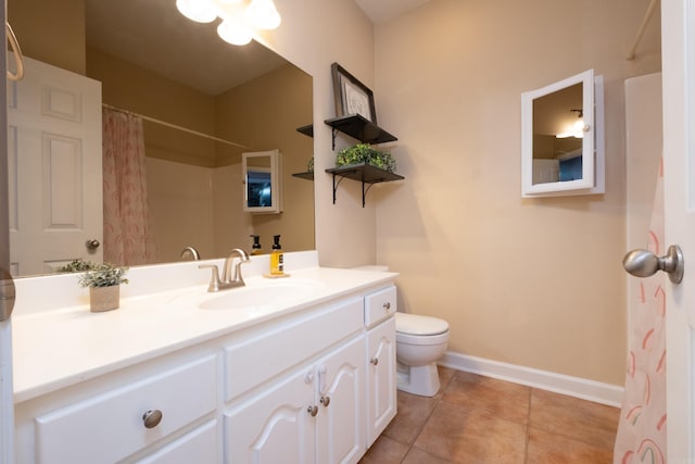 bathroom featuring toilet, a shower with shower curtain, tile patterned floors, and vanity