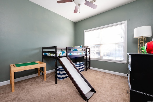 bedroom featuring ceiling fan and light colored carpet