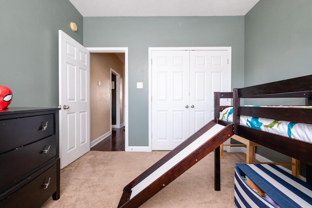 carpeted bedroom featuring a closet