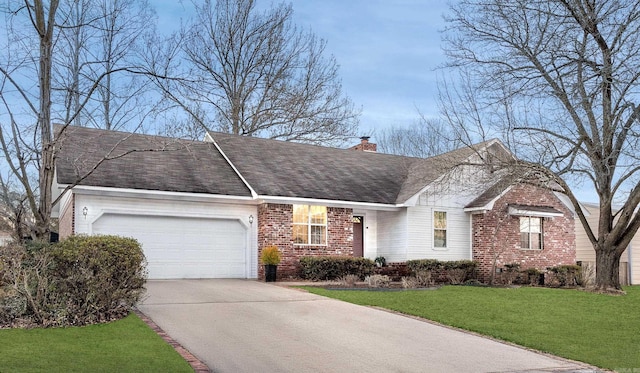 ranch-style home with a front yard and a garage