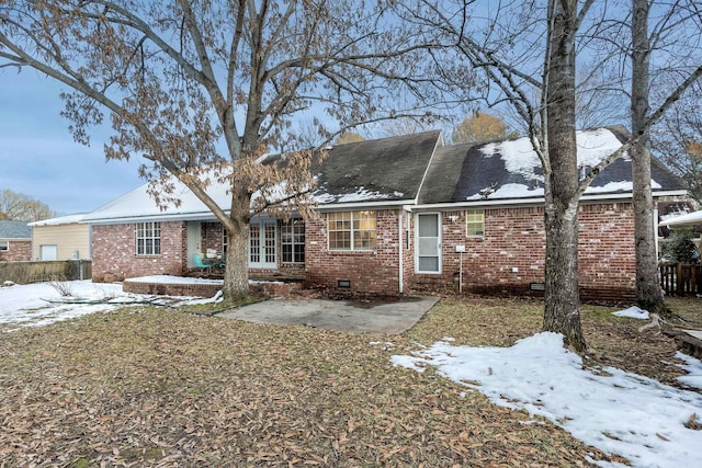 view of snow covered house