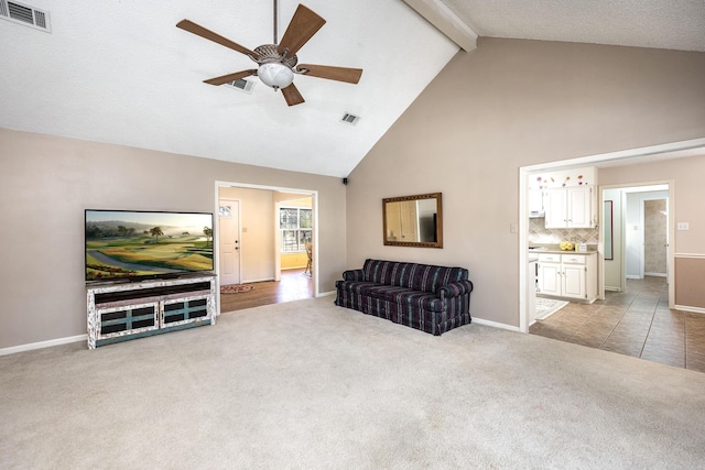 living room with light carpet, beam ceiling, ceiling fan, and high vaulted ceiling