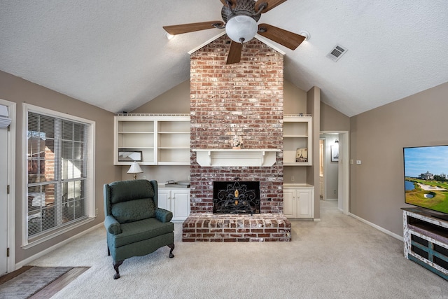 living room featuring a textured ceiling, a brick fireplace, lofted ceiling, and light colored carpet