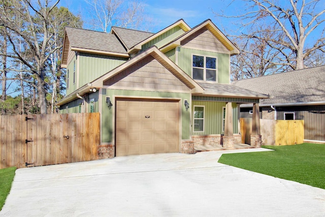 craftsman house with a porch and a front yard