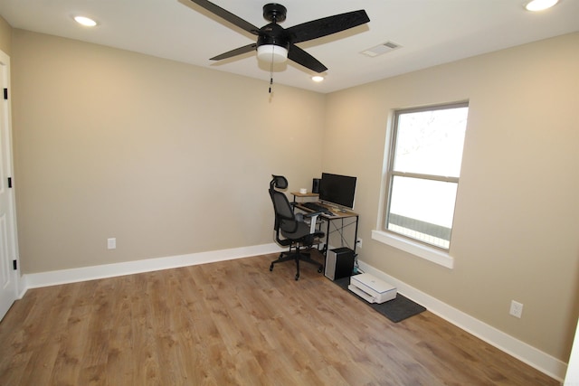 office area featuring light hardwood / wood-style floors and ceiling fan