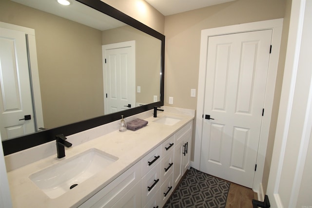 bathroom featuring hardwood / wood-style flooring and vanity