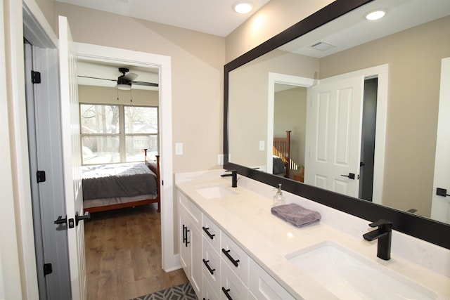 bathroom with ceiling fan, hardwood / wood-style floors, and vanity