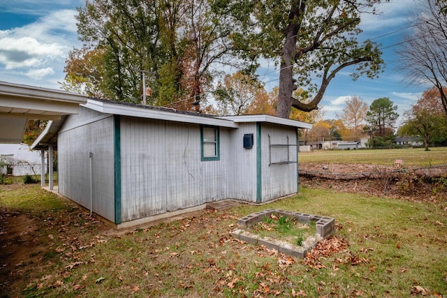 view of outdoor structure with a lawn