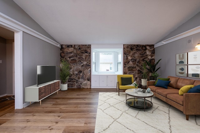 living room with vaulted ceiling and hardwood / wood-style flooring