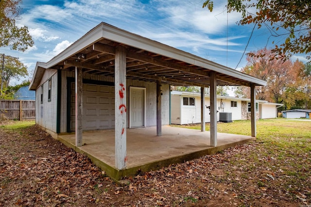 view of patio / terrace featuring cooling unit and an outdoor structure