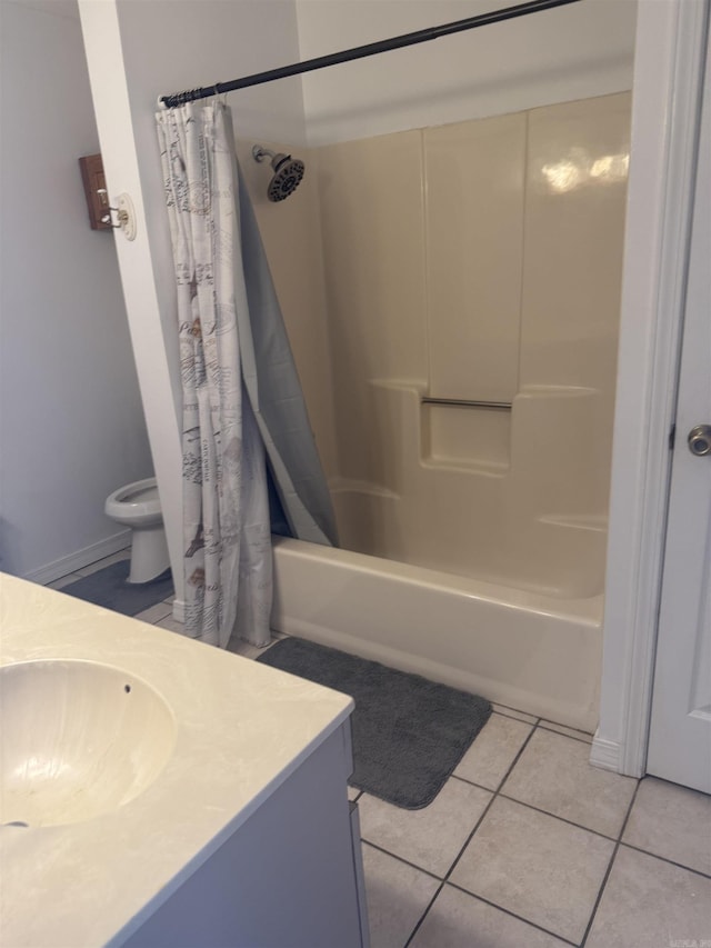 bathroom featuring toilet, shower / bathtub combination with curtain, vanity, and tile patterned floors