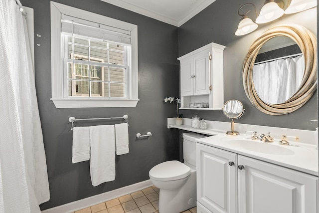 bathroom with tile patterned floors, vanity, crown molding, and toilet