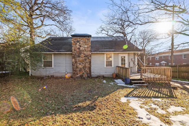 back of property featuring a deck