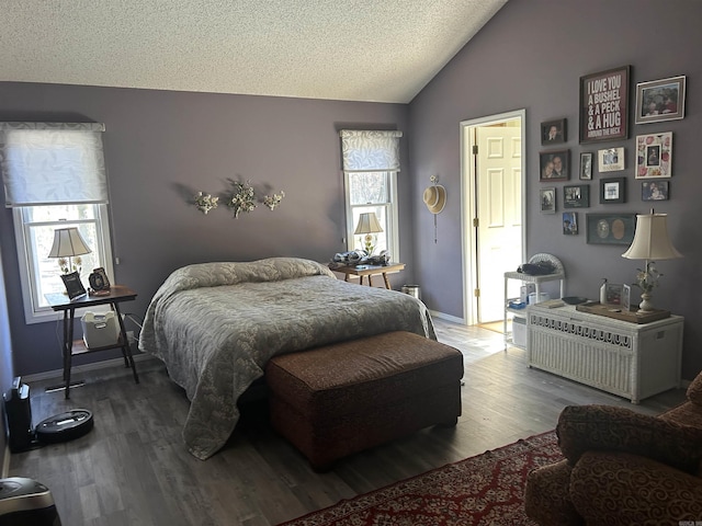 bedroom with vaulted ceiling, a textured ceiling, and wood-type flooring