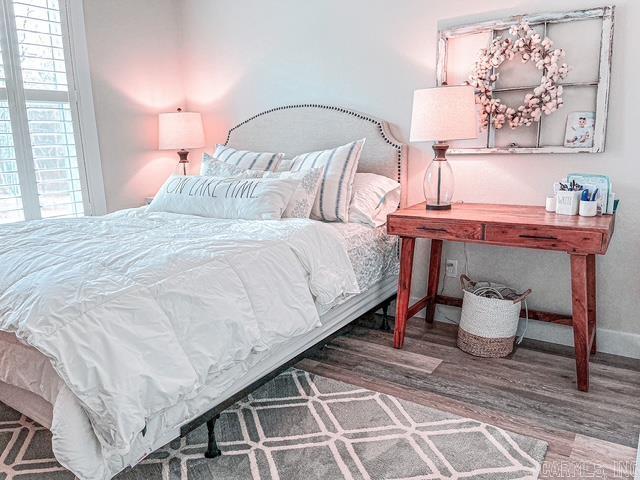 bedroom with wood-type flooring