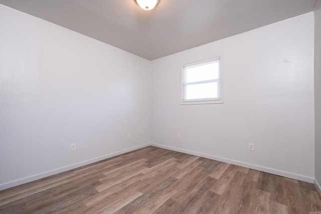 spare room featuring hardwood / wood-style flooring