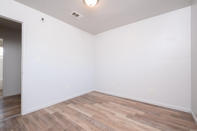 unfurnished room with light hardwood / wood-style flooring