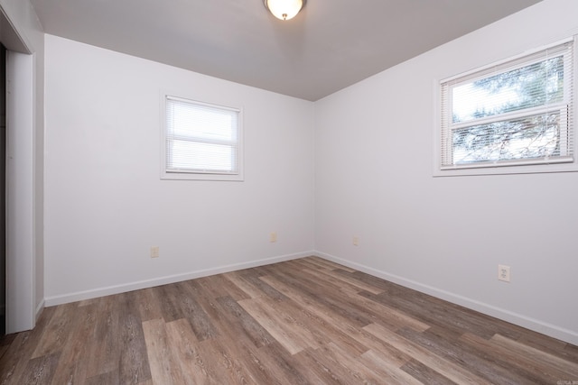 empty room featuring hardwood / wood-style flooring