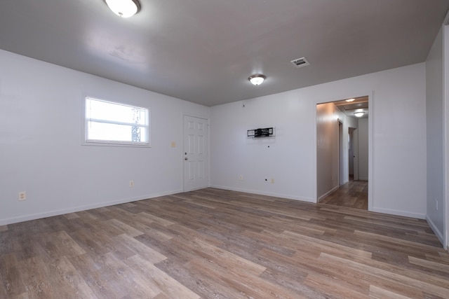 empty room featuring hardwood / wood-style flooring