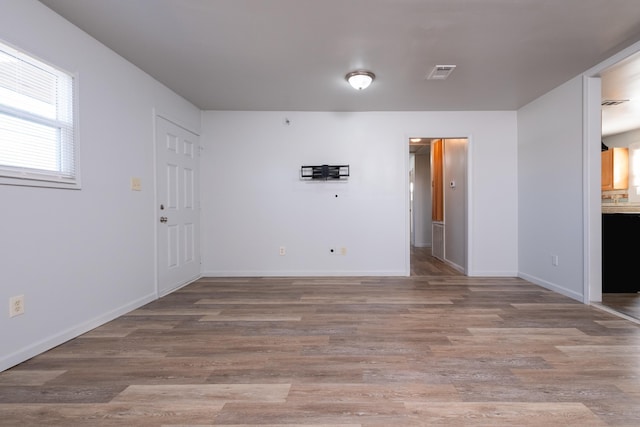 empty room with light wood-type flooring