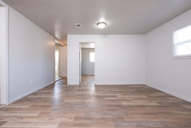 spare room with light hardwood / wood-style flooring