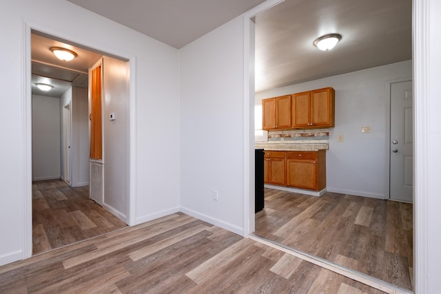 kitchen with backsplash and hardwood / wood-style flooring