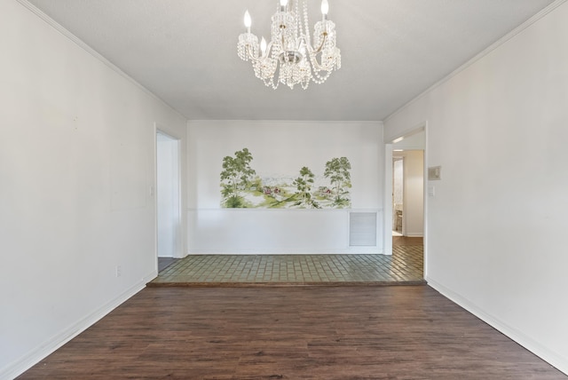 empty room with dark hardwood / wood-style floors and an inviting chandelier