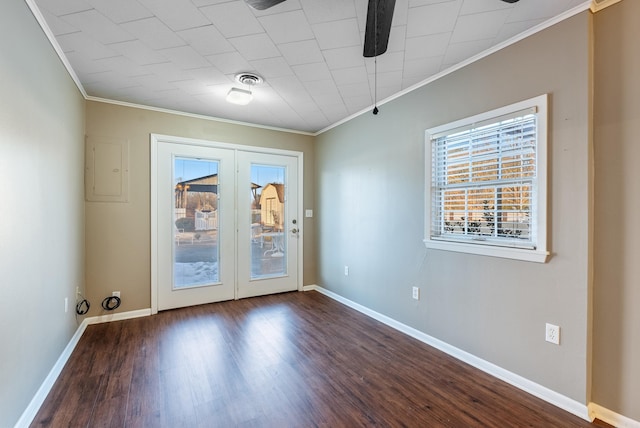 spare room featuring wood-type flooring, electric panel, ornamental molding, and french doors