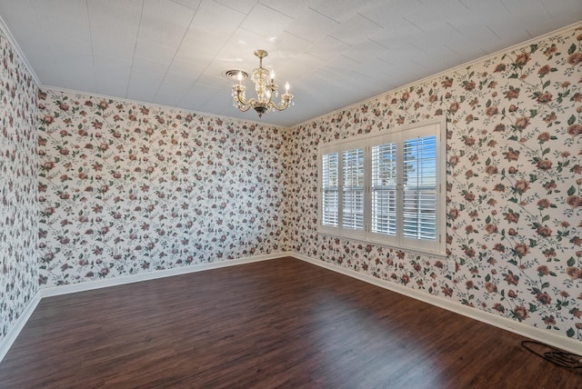 unfurnished room with a chandelier, dark hardwood / wood-style flooring, and ornamental molding