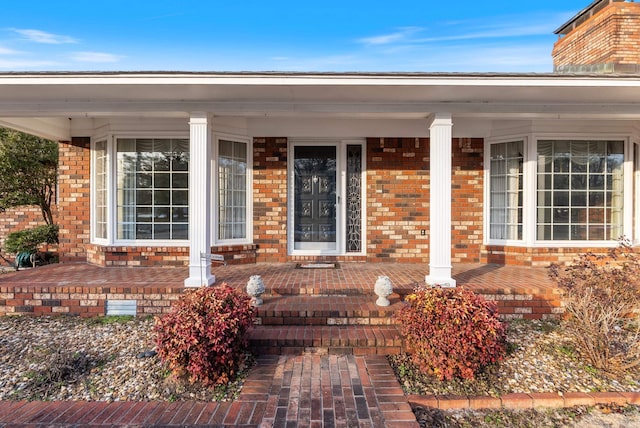 doorway to property with covered porch