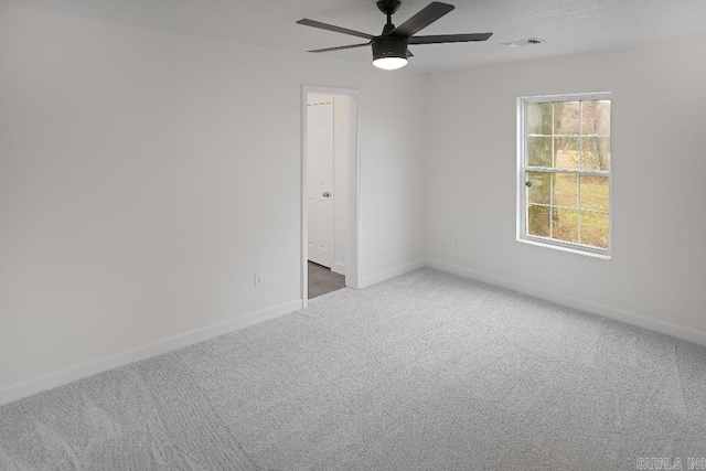 carpeted empty room with ceiling fan