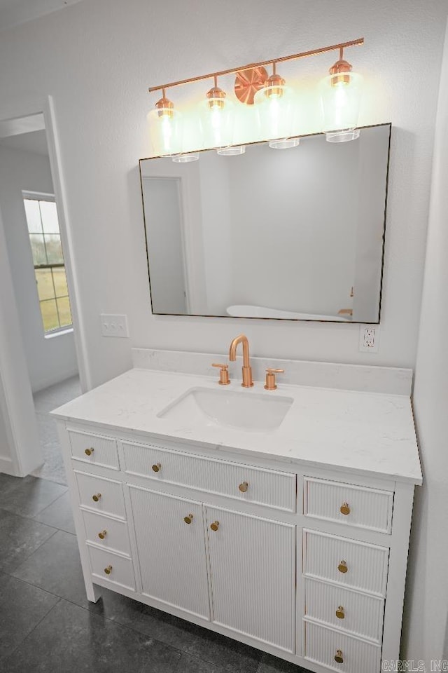 bathroom with vanity and tile patterned flooring