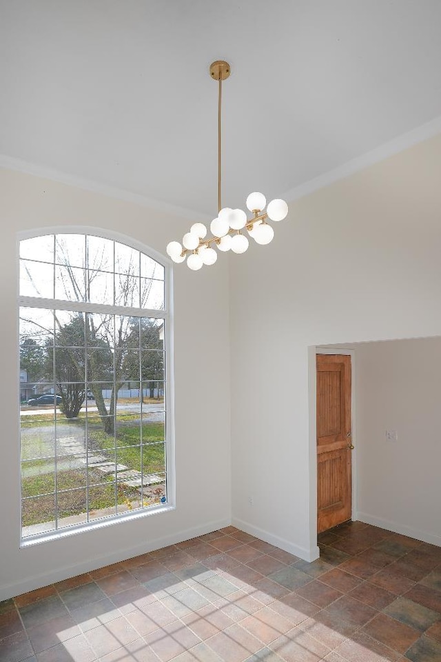 unfurnished dining area featuring plenty of natural light and crown molding