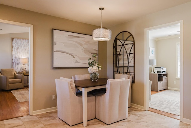 dining room featuring ornamental molding