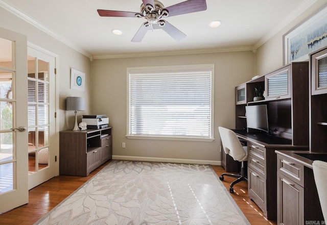 office space featuring ceiling fan, french doors, crown molding, and light hardwood / wood-style floors