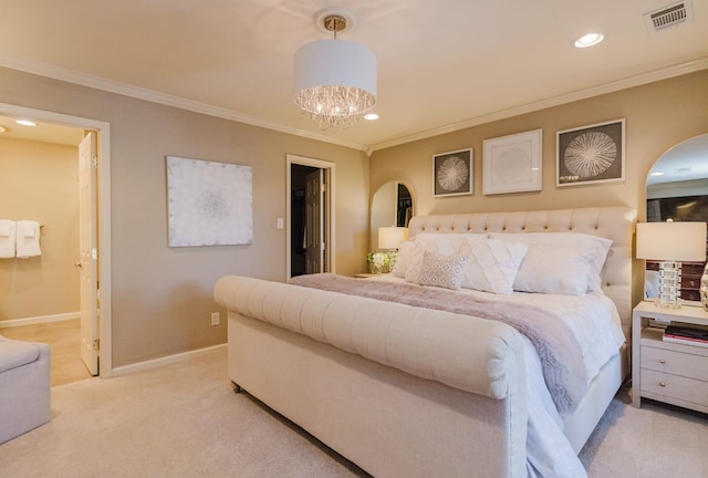 carpeted bedroom featuring a walk in closet, ornamental molding, and a notable chandelier