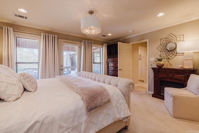 carpeted bedroom featuring ornamental molding, access to outside, and a notable chandelier