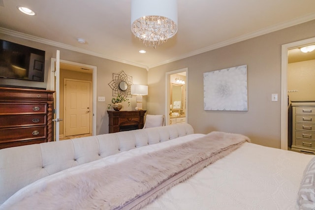 bedroom featuring connected bathroom, crown molding, and an inviting chandelier