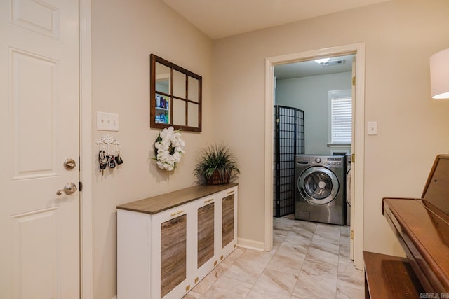 laundry room featuring separate washer and dryer