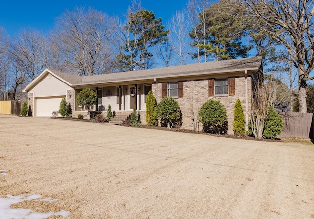 ranch-style house with covered porch and a garage