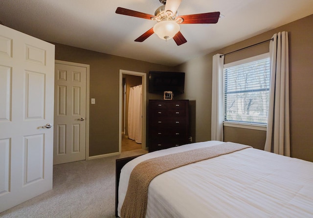 carpeted bedroom featuring ceiling fan