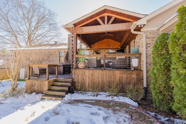 view of snow covered house