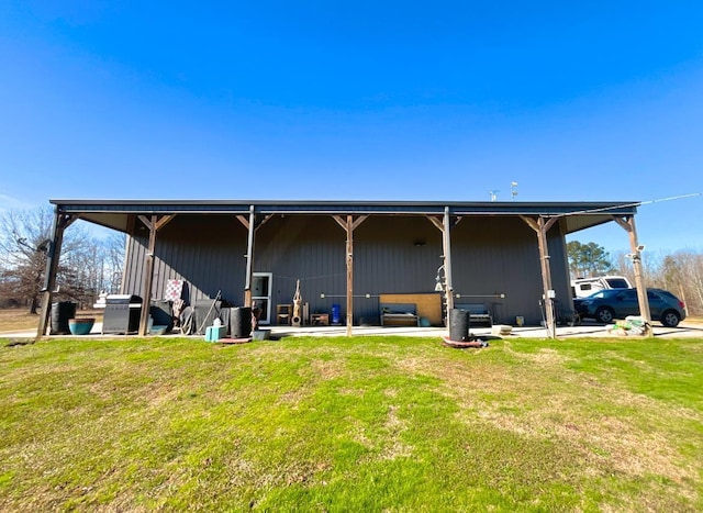 rear view of house with a yard