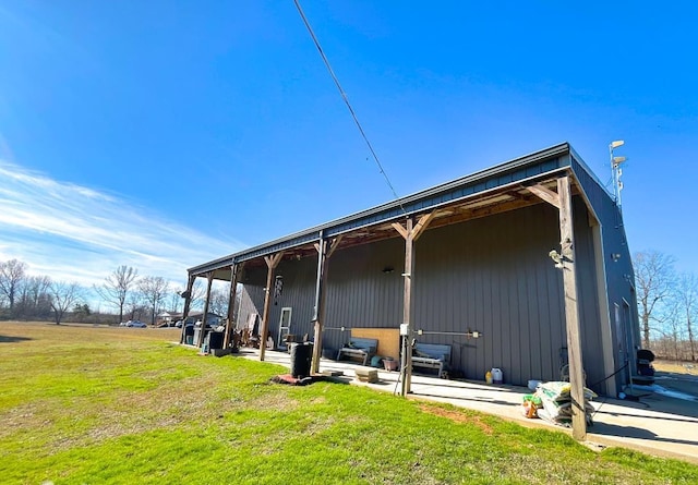 view of side of home featuring a yard