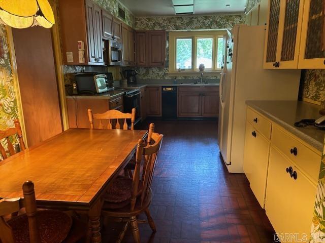 kitchen featuring sink and black appliances