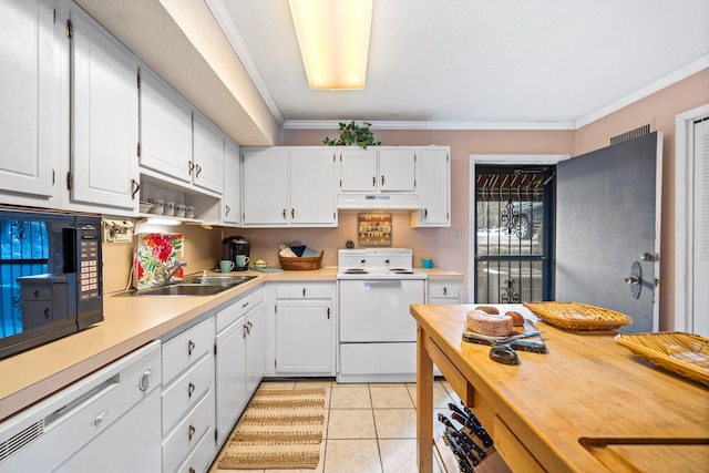 kitchen with white appliances, white cabinets, ornamental molding, and light tile patterned flooring