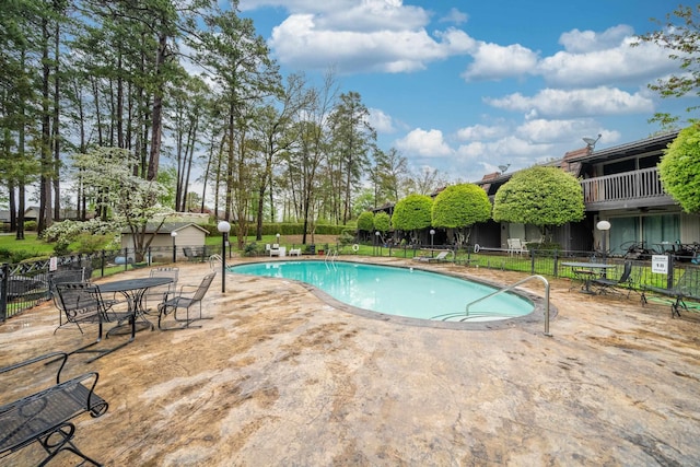 view of swimming pool featuring a patio area