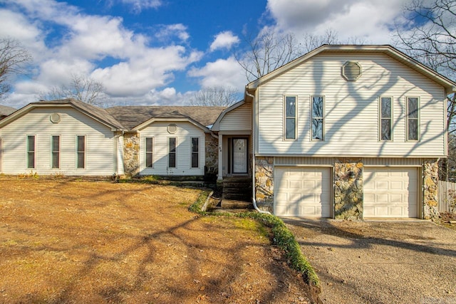 split level home featuring a garage