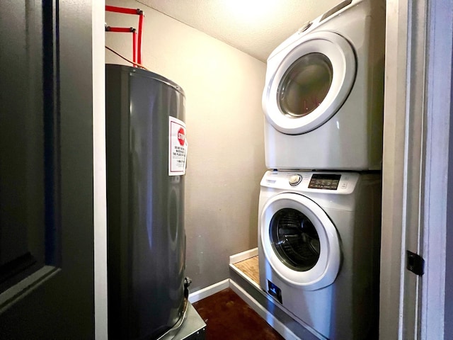 laundry area featuring stacked washing maching and dryer